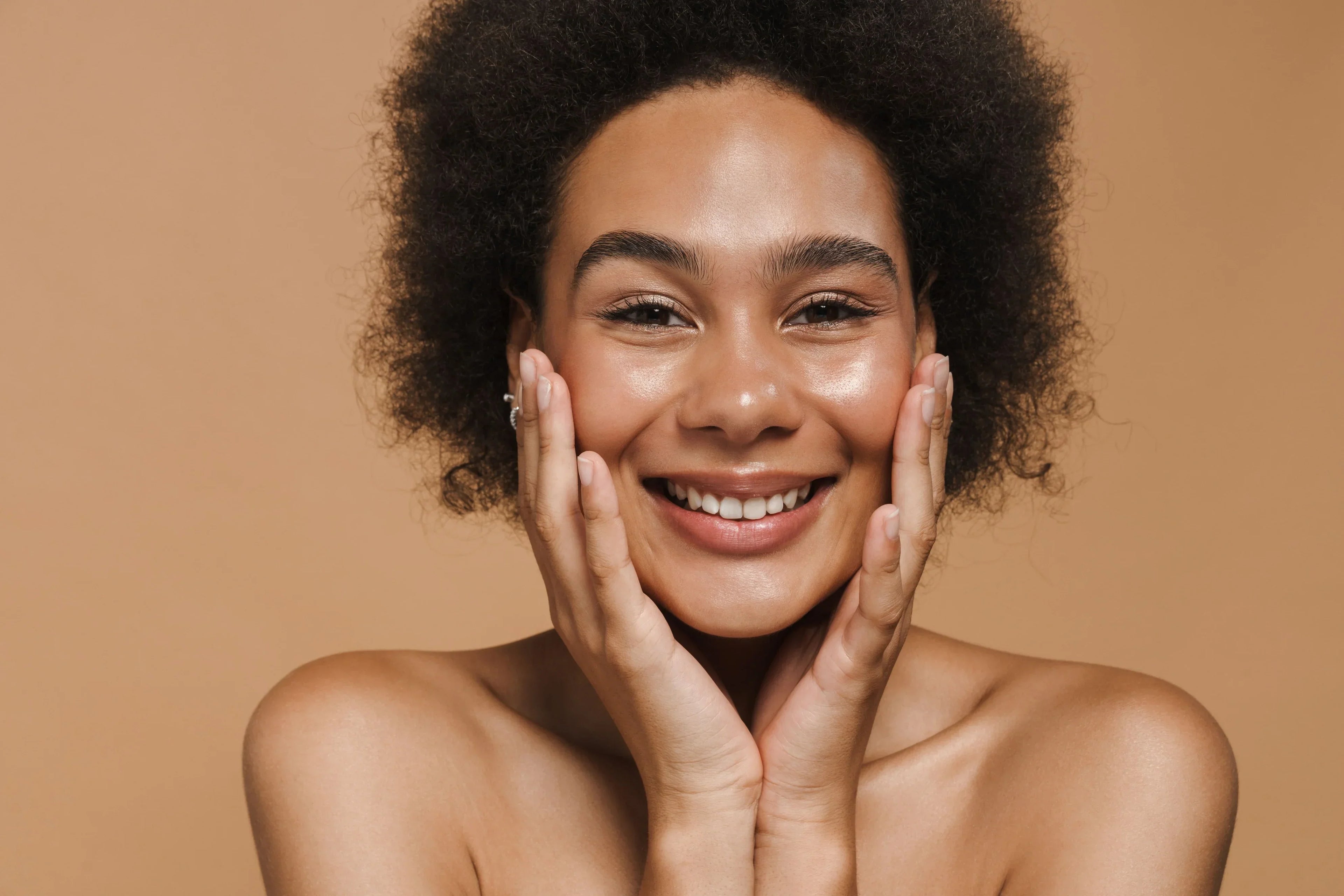 Woman with glowing skin smiling