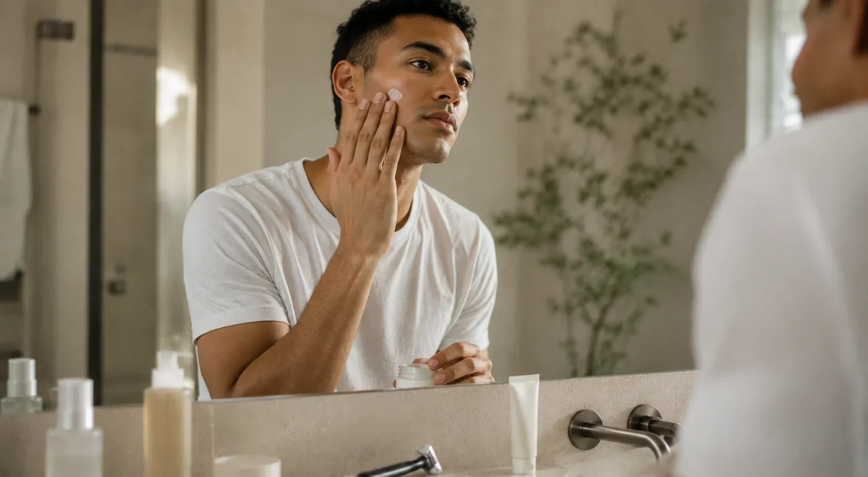 Man applying Korean skincare as part of his daily routine