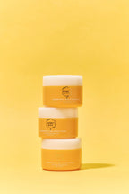 Three Venom Multi Solution Creams stacked of Honey Bee on a solid yellow background