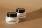 Two Mille de Fleur Blanche Repairing Crèmes on a beige background