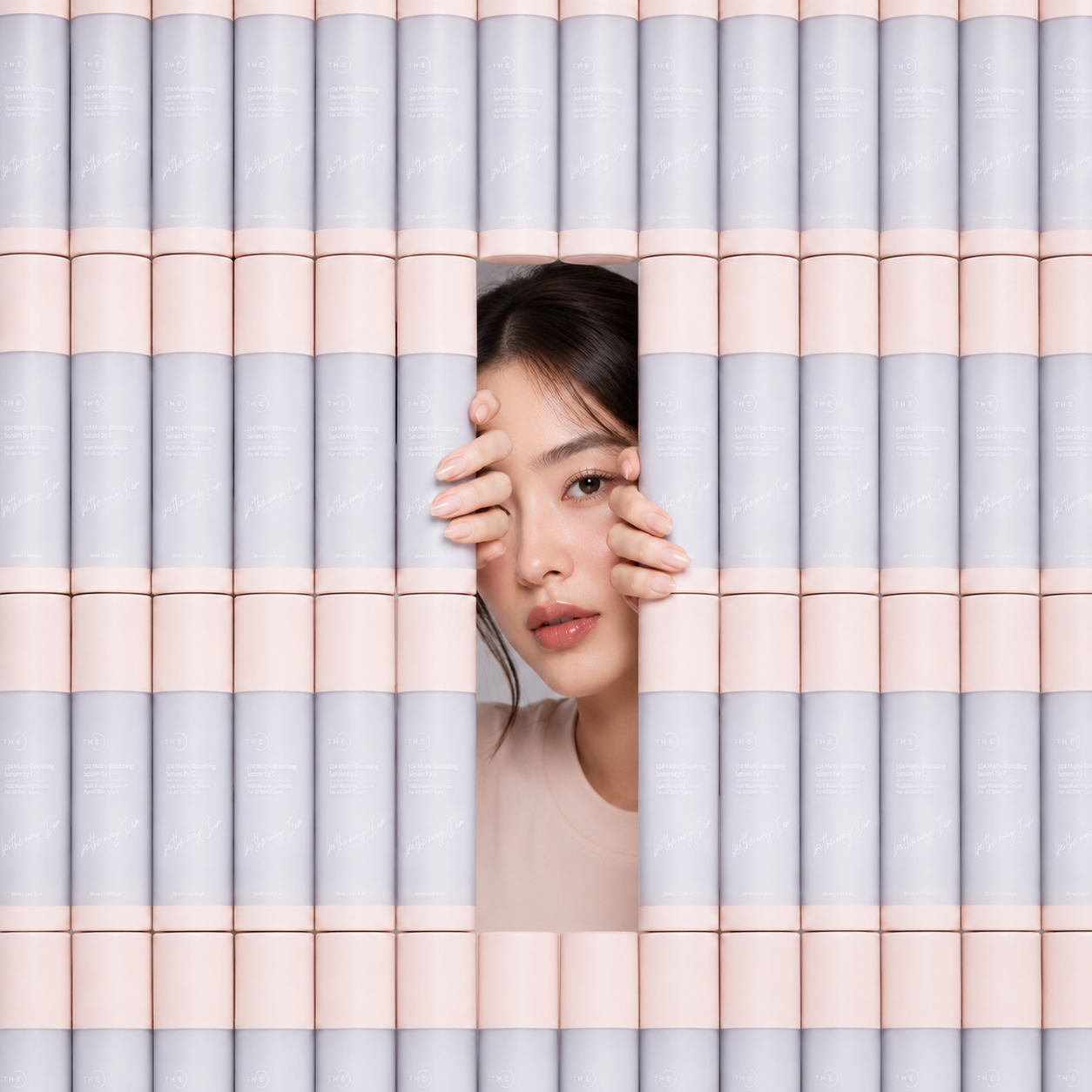 A woman in a wall made of anti-aging serum from The C